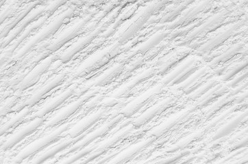 White abstract striped crumbly powder texture with diagonal lines, cracks, rows.