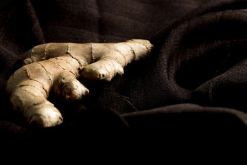 close photo ginger on brown cloth