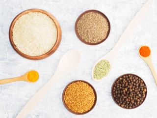 Spices set and rice on concrete background. Modern apothecary, naturopathy and ayurveda concept.