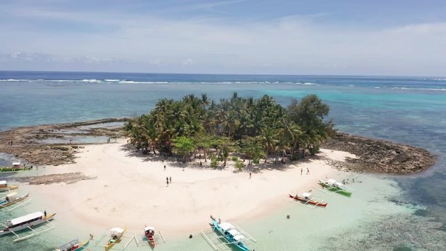 Flying down to the small tropical island Guyam in Siargo, the Philippines