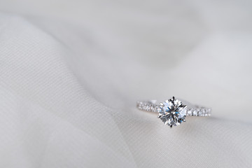 Engagement Diamond Ring on Wedding Dress