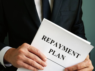 Repayment Plan that the man holds.