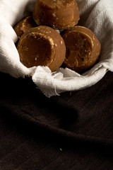 Colombian panela on basket and dark background