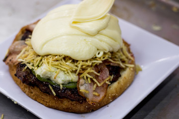 bacon burger, chopped potato and cheese