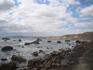 Stone beach, ocean and the sky