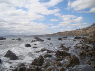 Stone beach, ocean and the sky