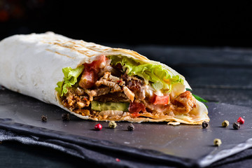 Mexican beef steak burritos with vegetable - obrazy, fototapety, plakaty