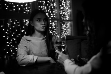 The girl in the evening in a cafe