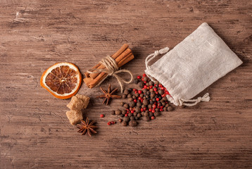 Spices and herbs on old kitchen table. Food and cuisine ingredients.