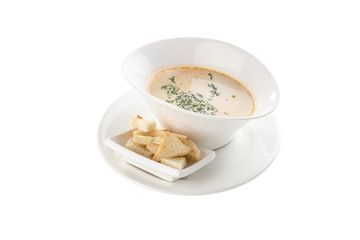 Fresh homemade vegetable soup with pea and croutons in white bowl isolated on white background