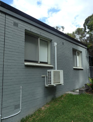 Example of ductless, Mini-Split Air Conditioner installed outside a home room.