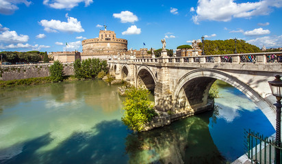 View of the Castel Sant'Angelo and the Angel Bridge on the Tiber in Rome Lazio Italy - obrazy, fototapety, plakaty