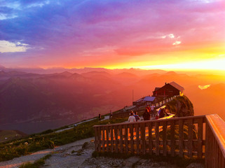 Epic amazing beautiful sunset sunrise over Austrian Alps on top of Schafkopf Mountain with mountain...