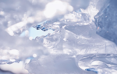 Fototapeta na wymiar Texture of ice on a spring day under the sun.