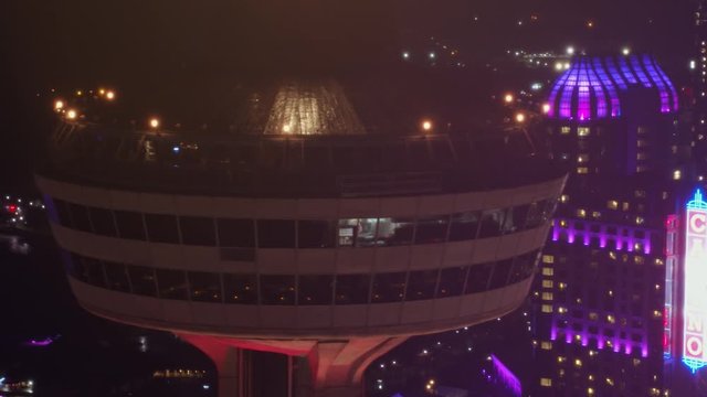 Niagara Falls Ontario Aerial v18 Panning Skylon Tower detail to reverse cityscape view at night - October 2017
