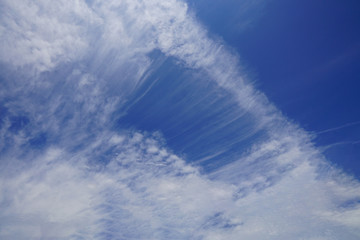 The blue sky and white clouds indicate pure and freshing