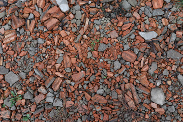 Crushed orange and grey brick texture, broken brick