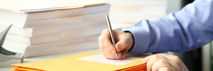 Businessman hold hand silver pen.