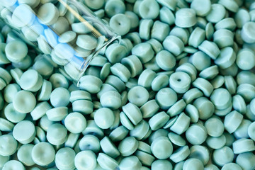 Close up of high-density polyethylene (HDPE) granules, selective focus.