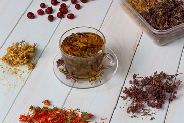 Freshly brewed tea from medicinal herbs. Dried medicinal herbs for health. 