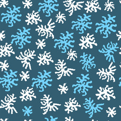Seamless pattern with white and blue snowflakes. Winter abstract elements for decoration of fabric, paper.