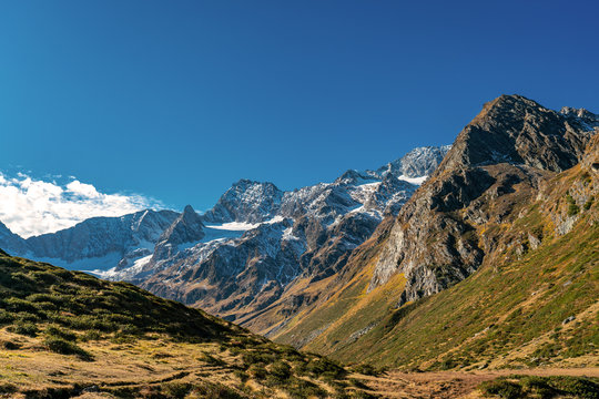 Hiking path at Timmelsjoch and Texelgruppe nature park leading to the Seebersee with the alpine mountains in the background