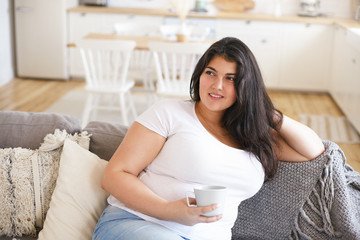 Beverage, food, healthy lifestyle and weight loss concept. Portrait of obese cute young Latin...