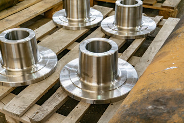 Transitional flange after manufacture on a wooden shelf.