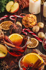 Christmas composition with Glass of glint wine on wooden table close up