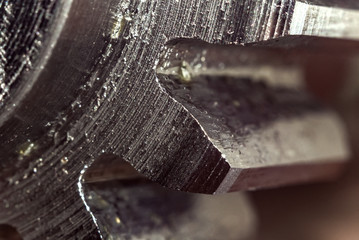 Gear closeup, macro photo of gear teeth.
