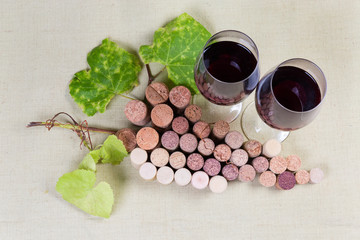 Wine corks lying in form of grape cluster, red wine