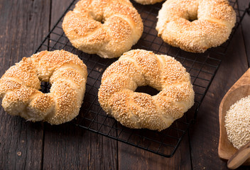 Seeds bagel stack bakery background. Homemade tasty bagel bun, white & black sesame, flax seeds, chia. Healthy breakfast food bakery background. German turkish bread brunch bagel - bakery background