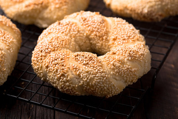 Seeds bagel stack bakery background. Homemade tasty bagel bun, white & black sesame, flax seeds, chia. Healthy breakfast food bakery background. German turkish bread brunch bagel - bakery background