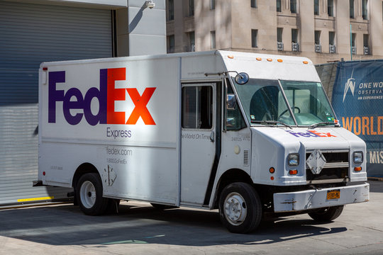 FedEx truck with a logo. FedEx is famous American multinational courier delivery services company.