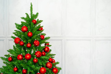 Beautiful Christmas tree with red baubles close up