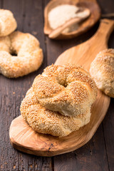 Greek koulouri or Turkish bagels called Simit in stack. Traditional street food, crispy sesame bread ring bagels