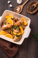 Holiday Dinner. Fried chicken wings with orange slices shot. Traditional festive food