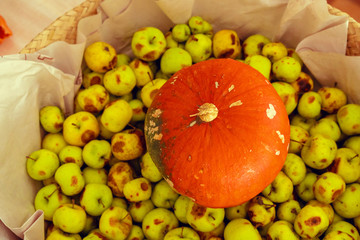 Naklejka na ściany i meble Basket with small green apples close up