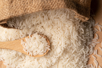 food background. thailand rice in a wooden spoon. soft focus