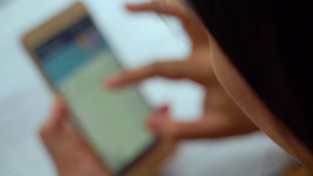 Selective focus women typing on smart phone business and modern lifestyle concept.