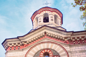 Fototapeta na wymiar Red Pantelimon church in Chisinau city in autumn