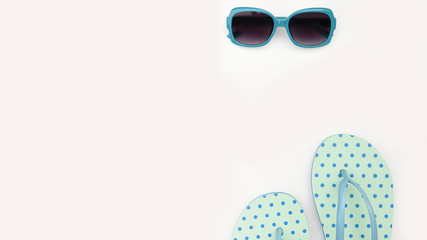 Sunglasses and sandals isolated on white background.
