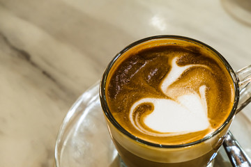 A cup of hot coffee late Recipe on the wooden table that is ready to drink in the morning before start the new working day