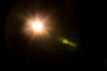 Abstract Natural Sun flare on the black background.