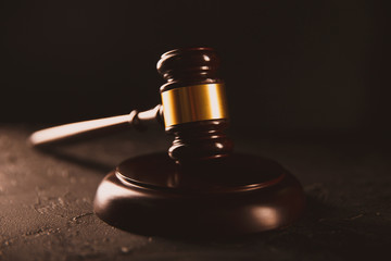 Law and justice concept. Dark gavel on the wooden table