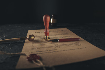 Notary's public pen and stamp on testament and last will. Notary public tools.