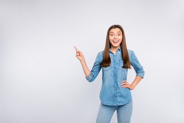 Portrait of amazed funny funky girl impressed look wonderful news about discounts promo point index finger indicate present wear casual style outfit isolated over white color background