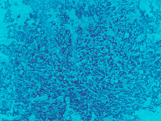 Intricate color patterns Malibu on a dark background. Concept of frozen window glass in winter.