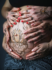 Henna tattoo on pregnant belly