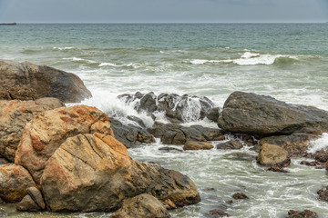 sea waves crushing on rocks